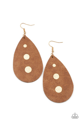 The front of a distressed leather teardrop frame is adorned into three glistening gold paint drops, creating a rustic elegance. Earring attaches to a standard fishhook fitting.