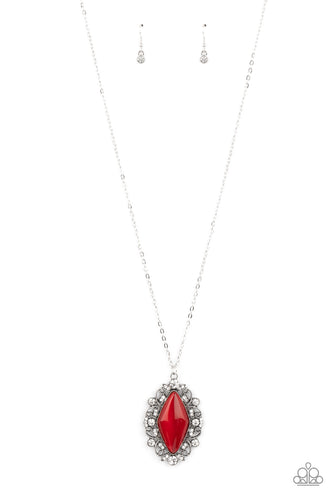 Dotted in glassy white rhinestones, leafy silver filigree blooms from an oversized red cat's eye stone, creating an enchanted pendant at the bottom of a lengthened silver chain. Features an adjustable clasp closure. 