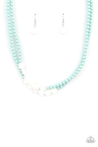 A summery collection of shiny white shell-like discs and dainty blue beads are threaded along invisible wire, creating colorful layers below the collar. Features an adjustable clasp closure.