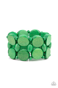 Earthy green wooden discs and beads are threaded along braided stretchy bands around the wrist, creating a summery display.