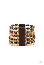 Load image into Gallery viewer, Held together with rectangular wooden frames, an earthy collection of white wooden beads and black, brown, and tan oval wooden beads are threaded along stretchy bands around the wrist for a bold beach inspired fashion.
