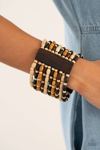 Held together with rectangular wooden frames, an earthy collection of white wooden beads and black, brown, and tan oval wooden beads are threaded along stretchy bands around the wrist for a bold beach inspired fashion.