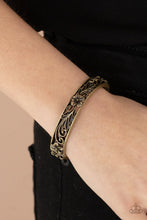 Load image into Gallery viewer, Filled with leafy tropical floral filigree, two antiqued brass frames connect into a whimsical bangle-like cuff around the wrist. Features a hinged closure.
