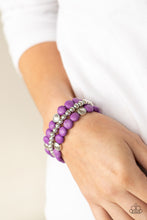 Load image into Gallery viewer, A vivacious collection of purple stone beads, ornate silver accents, and classic silver beads are threaded along stretchy bands around the wrist for a seasonally layered look.
