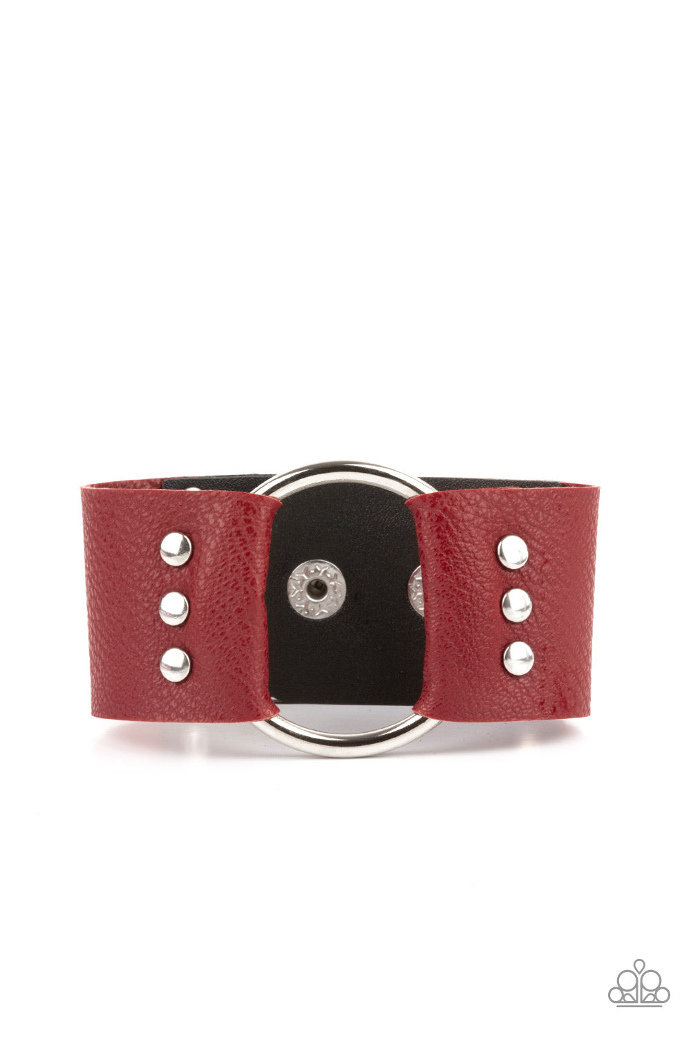 An oversized silver hoop is studded in place between the center of studded pieces of red and black leather, creating a rustic centerpiece around the wrist. Features an adjustable snap closure. 
