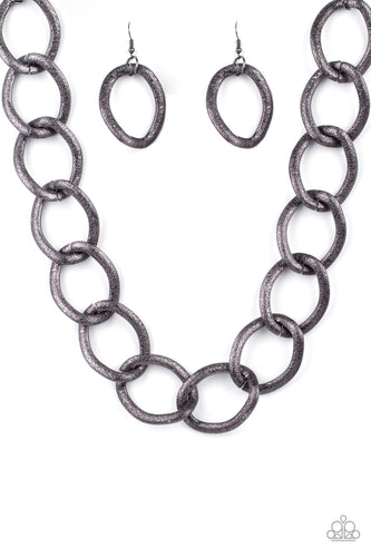 Surprisingly lightweight, enormous hematite links create an intimidating statement as they circle around the collar. The contoured, textured links have a distinctly industrial vibe that demands a second look. Features an adjustable clasp closure. 