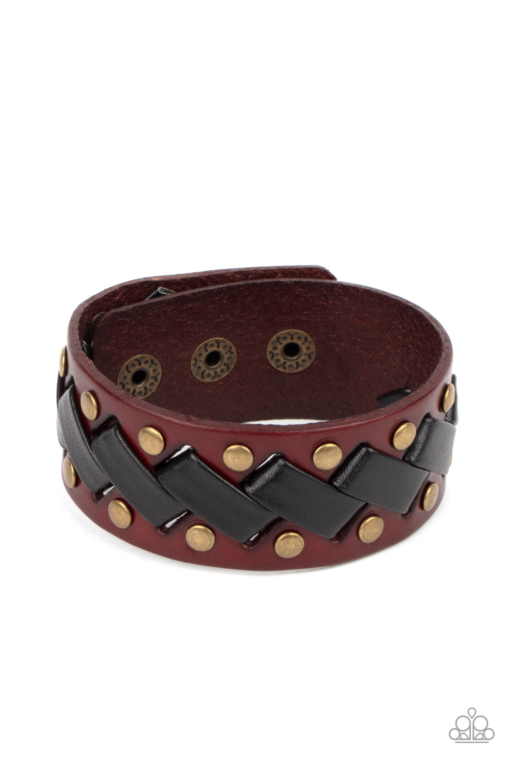 Thick black leather laces zigzag across the front brass studded brown leather band, creating a rustic display around the wrist. Features an adjustable snap closure.