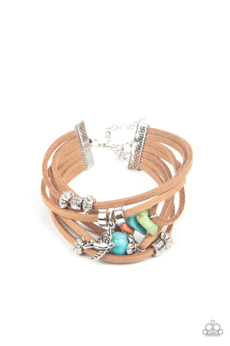 Infused with a dainty silver bird charm, dainty strands of brown suede are adorned in mismatched silver accents and multicolored stones for a colorfully layered look. Features an adjustable clasp closure.