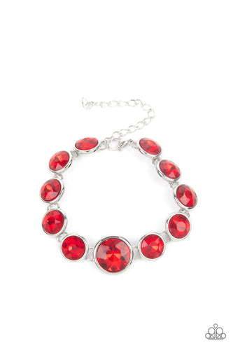 Featuring sleek silver fittings, an oversized collection of fiery red gems delicately link around the wrist. The centermost gem is slightly larger than the rest, adding a glamorous finish. Features an adjustable clasp closure.