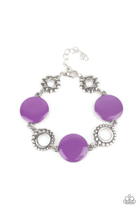 Featuring shiny Amethyst Orchid accents, studded silver circles and shimmery silver floral accents link around the wrist for a colorful display. Features an adjustable clasp closure.