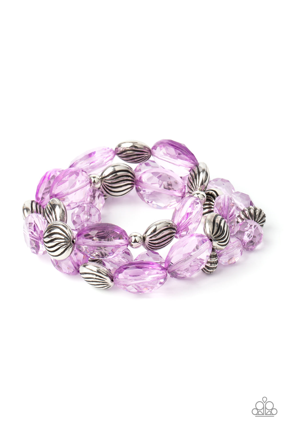 A mismatched collection of sparkly purple crystal-like beads and textured silver accents are threaded along stretchy bands around the wrist, creating glamorous layers.