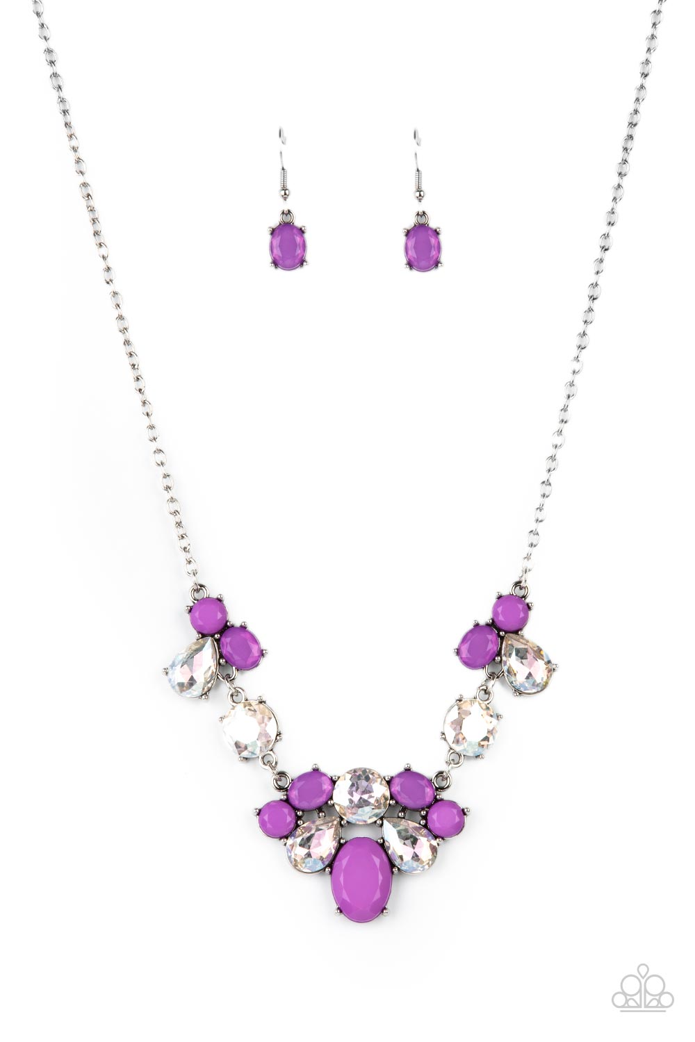 Varying in opacity and shape, mismatched purple beads attach to oversized white rhinestones, creating bubbly frames that delicately link into an ethereal display below the collar. Features an adjustable clasp closure 