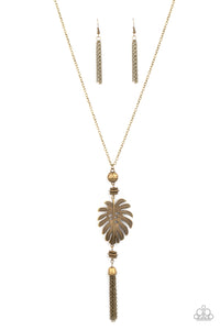 Infused with brass beaded accents, a lifelike brass palm leaf frame attaches to the bottom of a rustic brass chain. An antiqued brass chain tassel swings from the bottom, adding flirtatious movement to the summery statement piece. Features an adjustable clasp closure. 