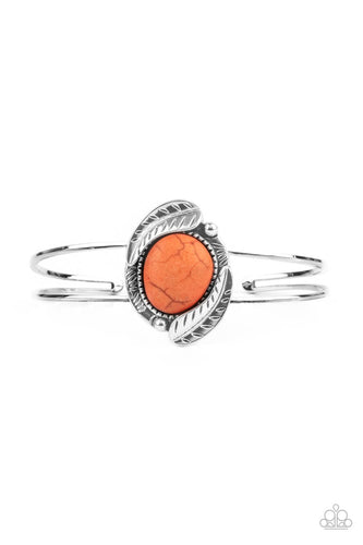 Feathery silver frames nestled around a refreshing orange stone center, creating a seasonal centerpiece atop a dainty silver cuff