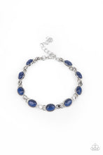 Load image into Gallery viewer, Featuring studded silver fittings, blue cat&#39;s eye stone frames delicately connect with ornate silver links around the wrist for an enchanted fashion. Features an adjustable clasp closure. 

