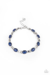 Featuring studded silver fittings, blue cat's eye stone frames delicately connect with ornate silver links around the wrist for an enchanted fashion. Features an adjustable clasp closure. 