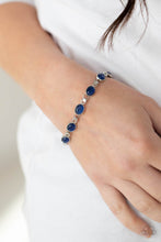 Load image into Gallery viewer, Featuring studded silver fittings, blue cat&#39;s eye stone frames delicately connect with ornate silver links around the wrist for an enchanted fashion. Features an adjustable clasp closure. 
