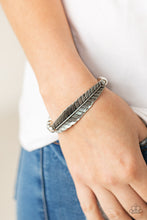 Load image into Gallery viewer, Infused with a lifelike silver feather frame, a row of shiny silver beads are threaded along a stretchy band around the wrist for a seasonal fashion. 
