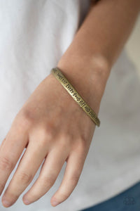 Featuring a subtle twist, a burnished brass bangle is engraved in the biblical passage, "Every good gift and every perfect gift is from above.--James 1:17," for an inspirational finish.