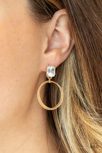 Load image into Gallery viewer, Encased in a pronged gold setting, a white emerald cut rhinestone links with a trio of refined textured gold rings, creating a romantic lure. Earring attaches to a standard post fitting. 
