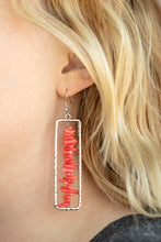 Load image into Gallery viewer, Bits of linear red rock are threaded along a metal rod inside a hammered silver rectangle, creating an earthy frame. Earring attaches to a standard fishhook fitting.
