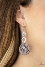 Load image into Gallery viewer, Reminiscent of an eclipse, an airy silver ring radiating with ornate petals, sways in front of a brown shell-like disc. Silver rings in graduating sizes cascade from the top for a whimsically nautical look. Earring attaches to a standard fishhook fitting.
