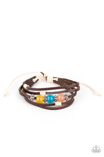 Infused with studded silver accents, a row of Desert Mist, Blue Tint, and Illuminating cat's eye stone beads adorn the centermost strand of layered leather bands around the wrist for a colorful seasonal look. Features an adjustable sliding knot closure.