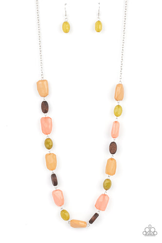 Varying in opacity, a mixed assortment of faceted Willow, Burnt Coral, and Desert Mist beads delicately link with dainty wooden beads across the chest, creating a whimsically earthy display. Features an adjustable clasp closure.