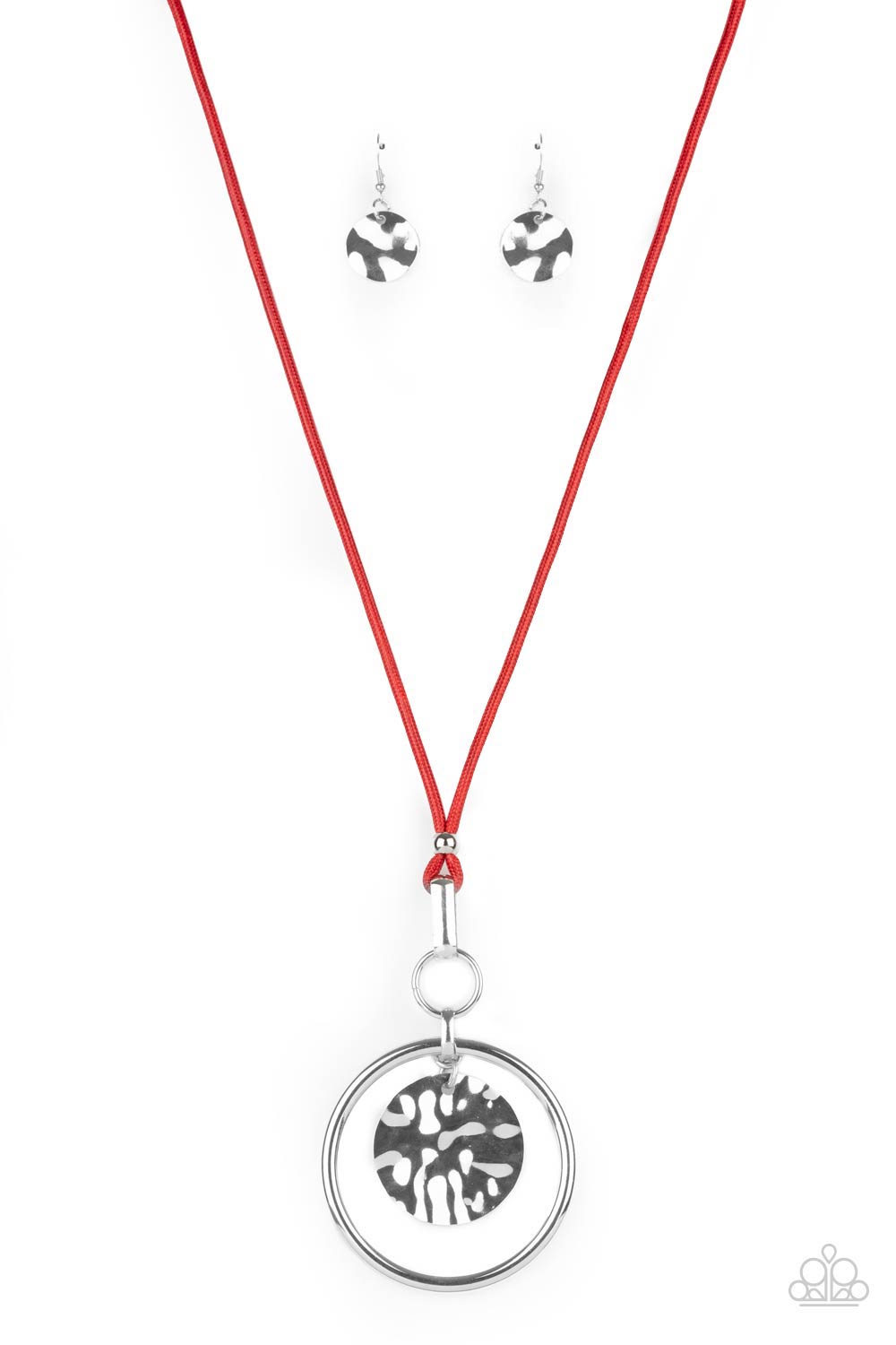 An oversized hammered disc swings from the top of a bold silver hoop that attaches to mismatched silver fittings at the bottom of a lengthened red cord, creating a dramatic pendant. Features an adjustable clasp closure.