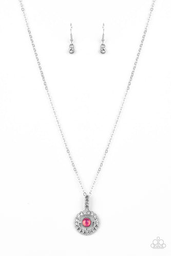 A white rhinestone encrusted fitting attaches to a ring of white rhinestones dotted with a glassy pink beaded center, creating a twinkly pendant at the bottom of a classic silver chain. Features an adjustable clasp closure.