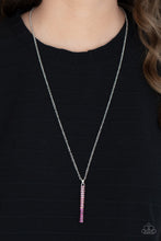 Load image into Gallery viewer, A sparkly collection of spectrum pink rhinestones are encrusted along a silver pendulum that swings along the bottom of a silver chain, creating a glittery ombre effect. Features an adjustable clasp closure.
