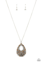 Load image into Gallery viewer, A sparkly explosion of glassy white and golden topaz rhinestones haphazardly coalesce into a teardrop frame at the bottom of a lengthened silver chain, creating a twinkly pendant. Features an adjustable clasp closure.
