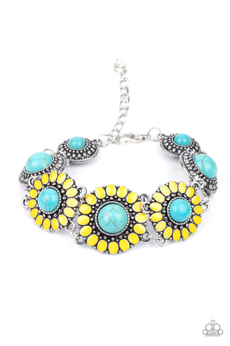 Featuring refreshing turquoise stone centers, studded silver frames double-link with yellow petaled floral frames around the wrist for a colorfully seasonal look. Features an adjustable clasp closure. 