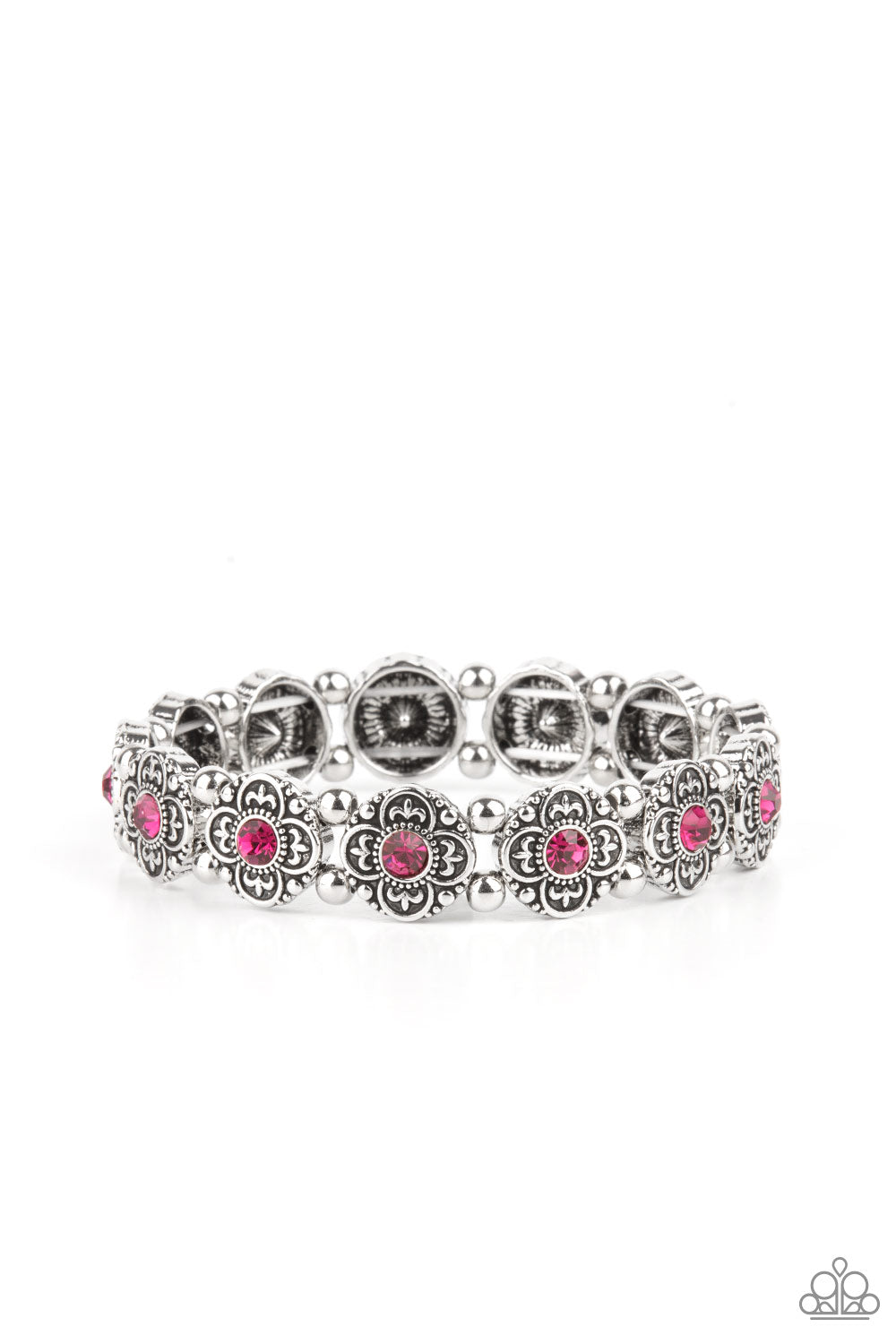Dotted with glittery pink rhinestone centers, antiqued silver floral frames and dainty silver beads are threaded along stretchy bands around the wrist for a seasonal twist.