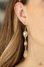 Load image into Gallery viewer, A trio of teardrop and marquis cut golden gems fall in succession from the ear. The teardrops are set in gold frames studded with white rhinestones for a sparkly finish. Earring attaches to a standard fishhook fitting.
