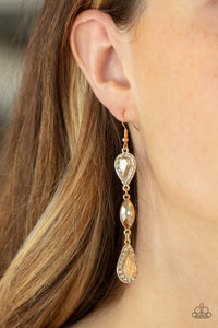 A trio of teardrop and marquis cut golden gems fall in succession from the ear. The teardrops are set in gold frames studded with white rhinestones for a sparkly finish. Earring attaches to a standard fishhook fitting.