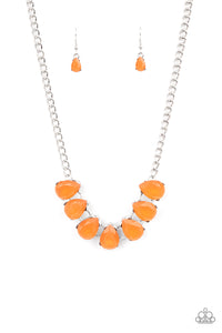 Dewy orange teardrop gems are nestled inside pronged silver frames that delicately connect below the collar, creating an ethereal centerpiece. Features an adjustable clasp closure. 