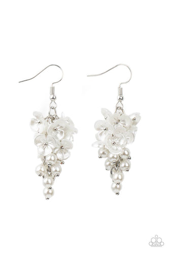A cluster of pearly white floral frames and dainty white pearls trickle from a silver chain, creating a romantic chandelier. Earring attaches to a standard fishhook fitting.