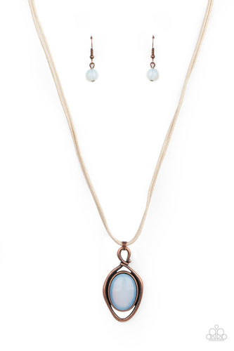 An oversized moonstone is pressed into a copper oval frame, outlined with an unexpected irregular shaped frame. The eye-catching pendant suspends from a double strand of natural cord below the collar for a mysterious finish. Features an adjustable clasp closure.