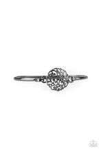 Load image into Gallery viewer, Shiny gunmetal filigree swirls into a round frame that hooks to a dainty gunmetal bangle-like cuff, creating a whimsical centerpiece. Features a hinge-like closure.
