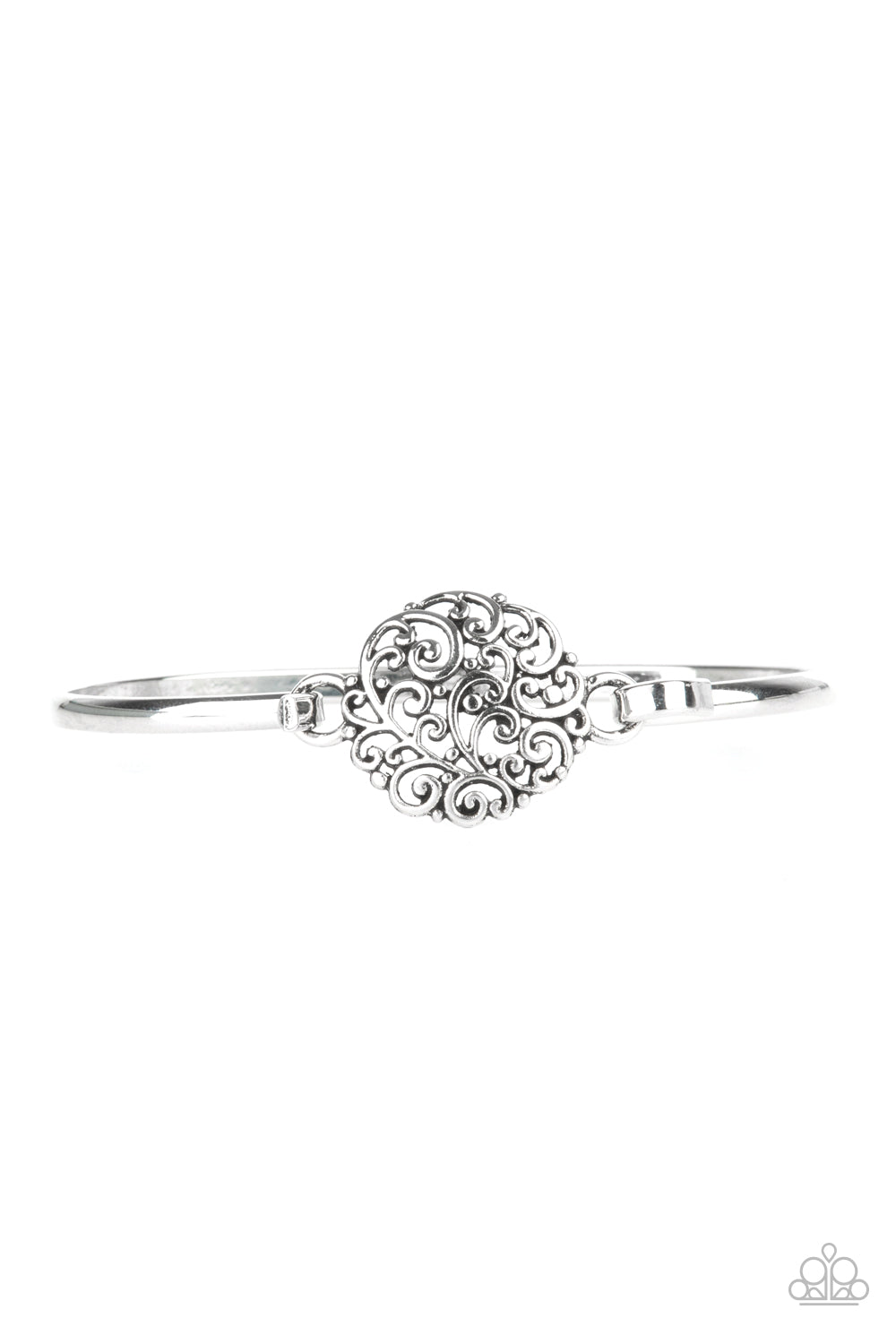 Shiny silver filigree swirls into a round frame that hooks to a dainty silver bangle-like cuff, creating a whimsical centerpiece. Features a hinge-like closure. 