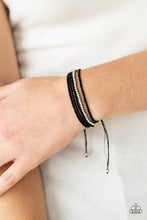 Load image into Gallery viewer, A single accent strand of silver beads merges with multiple strands of micro black beads for a simple yet trendy look. Features an adjustable sliding knot closure.
