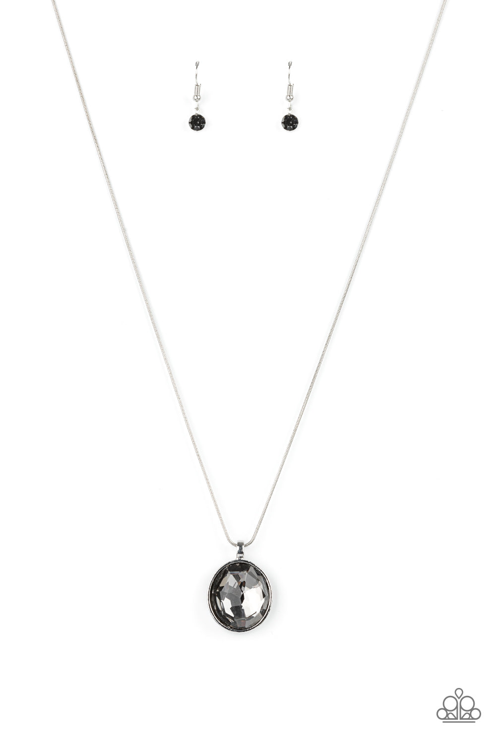 An oversized smoky gem is pressed into the center of a sleek silver fitting, creating a mesmerizing statement piece at the bottom of a sleek silver chain. Features an adjustable clasp closure.