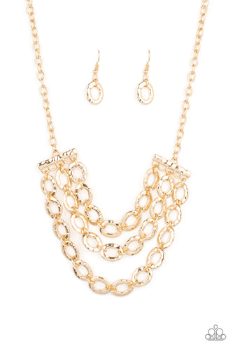 Three rows of gold chains with oversized hammered oval links attach to gold bars for an edgy display below the collar. Features an adjustable clasp closure.