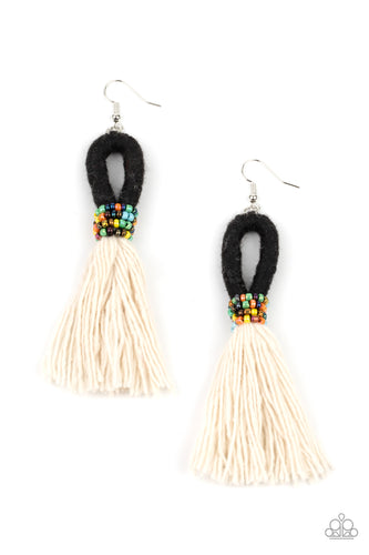A tassel of soft white cotton fans out under rows of brightly colored seed beads.  Anchored by a loop of jet black floss, the eye-catching style swings from the ear for a show-stopping statement. Earring attaches to a standard fishhook fitting.