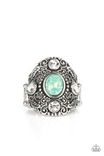 Load image into Gallery viewer, A dewy green gem adorns the center of an oversized antiqued frame embossed in silver leafy vine-like filigree. Round and teardrop white rhinestones adorn the four points of the frame, adding a classic sparkle to the ethereal centerpiece. Features a stretchy band for a flexible fit.
