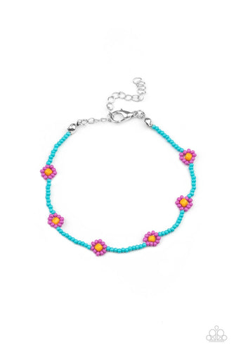 Bright Lavender flowers circle around a turquoise beaded bracelet for a crafty summer camp vibe. Features an adjustable clasp closure.