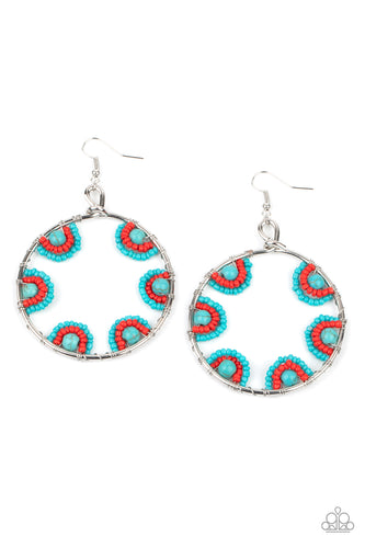 Red and turquoise seed beads are threaded on wires and looped over turquoise stones on the inside of a spacious silver hoop. The pattern makes its way around the inside of the circle for an around-the-world air. Earring attaches to a standard fishhook fitting. 