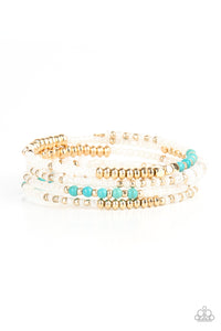 Sections of pearly white seed beads alternate with gold, turquoise, and crystal-like beads in infinite rows. The dreamy colors are threaded along a continuous strand of wire for an infinity wrap-style bracelet around the wrist