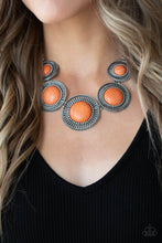 Load image into Gallery viewer, Earthy orange stones, pressed into round antiqued silver frames featuring dot and interlinking loop motifs, create a dramatically rustic statement as they link across the collar. Features an adjustable clasp closure.
